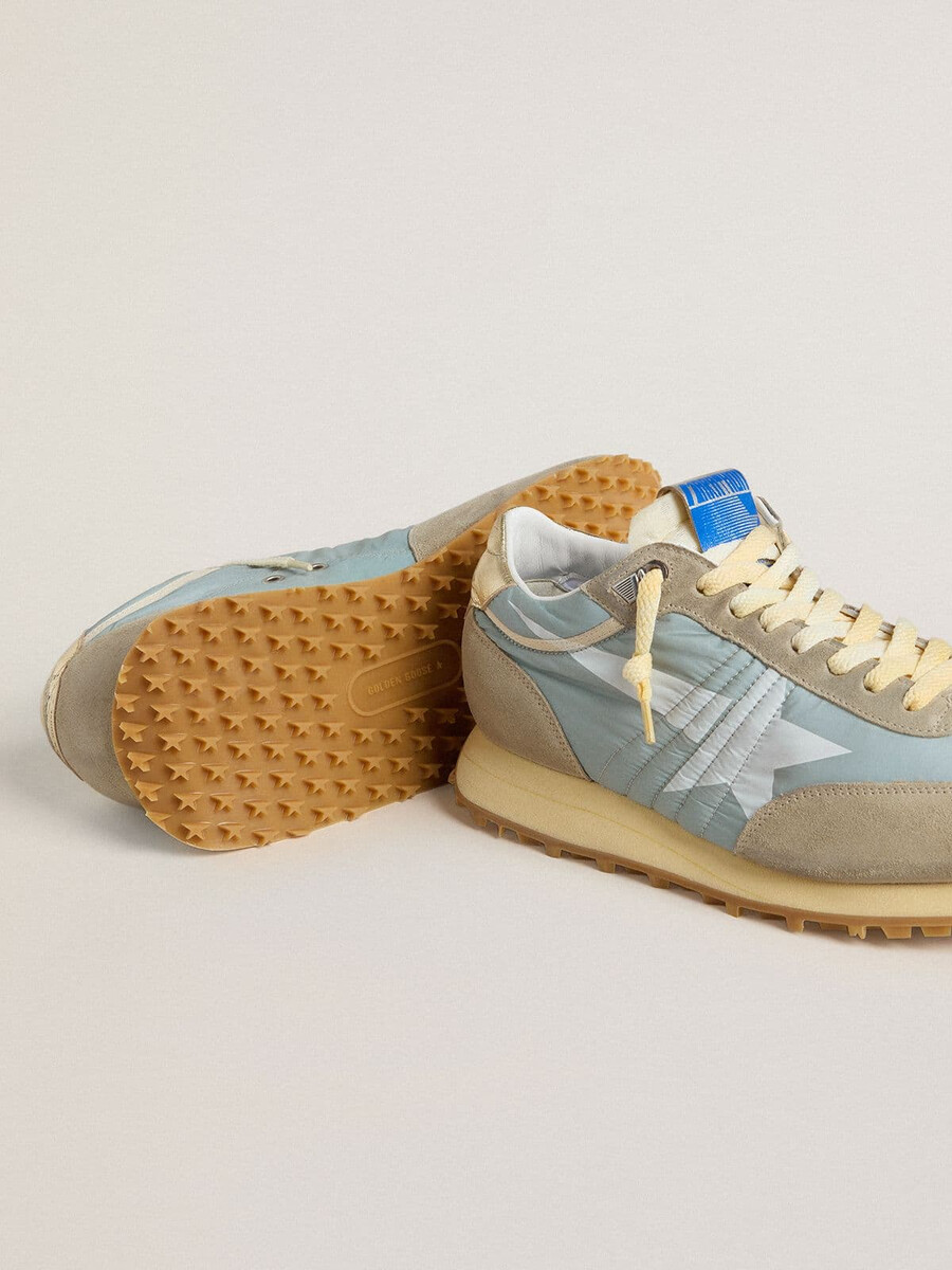 maratón para hombre con parte superior de nailon azul claro y estrella azul pastel
